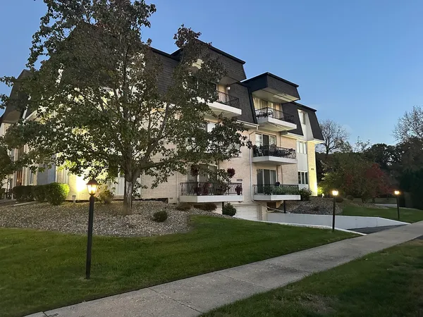 a view of a building with a yard