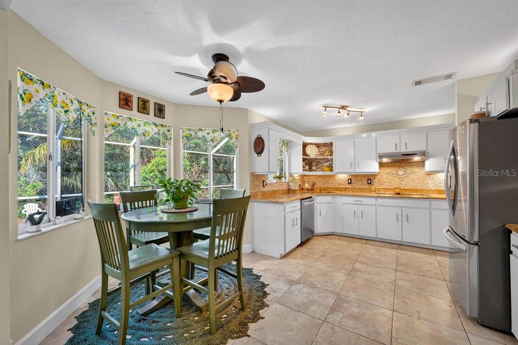 4758 South Peninsula Drive Ponce Inlet, FL 32127 - Photo 11 of 53 a view of a dining room with furniture window and outside view