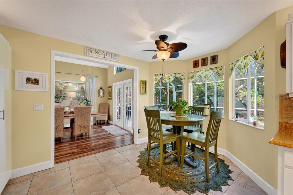 4758 South Peninsula Drive Ponce Inlet, FL 32127 - Photo 12 of 53 a view of a dining room with furniture window and outside view