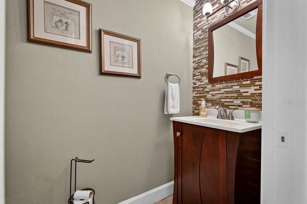 4758 South Peninsula Drive Ponce Inlet, FL 32127 - Photo 16 of 53 a bathroom with a sink and a mirror