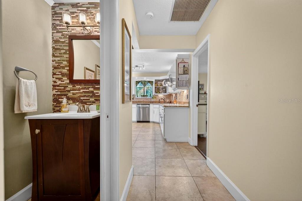 4758 South Peninsula Drive Ponce Inlet, FL 32127 - Photo 17 of 53 a view of a kitchen from the hallway