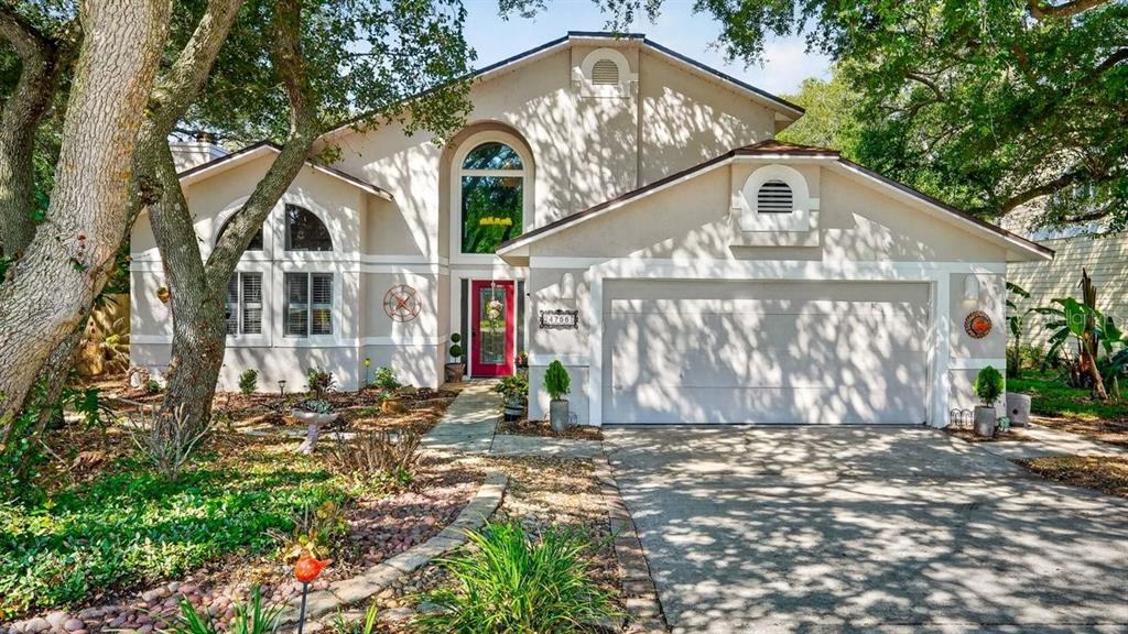 4758 South Peninsula Drive Ponce Inlet, FL 32127 - Photo 2 of 53 a front view of a house with a yard