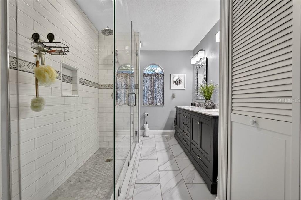 4758 South Peninsula Drive Ponce Inlet, FL 32127 - Photo 21 of 53 a bathroom with a mirror
