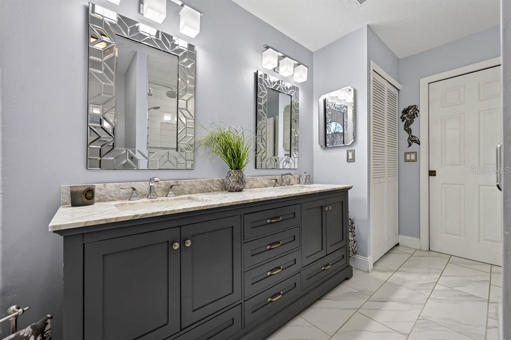 4758 South Peninsula Drive Ponce Inlet, FL 32127 - Photo 23 of 53 a bathroom with a double vanity sink mirror and double