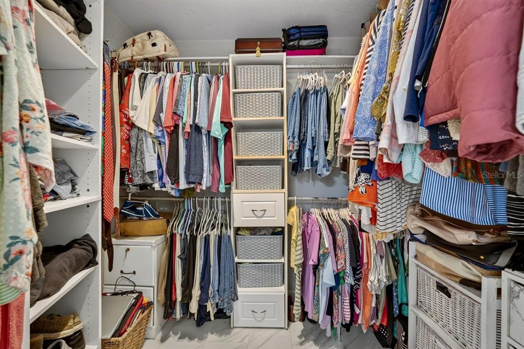 4758 South Peninsula Drive Ponce Inlet, FL 32127 - Photo 24 of 53 a view of walk in closet with clothes and shoes