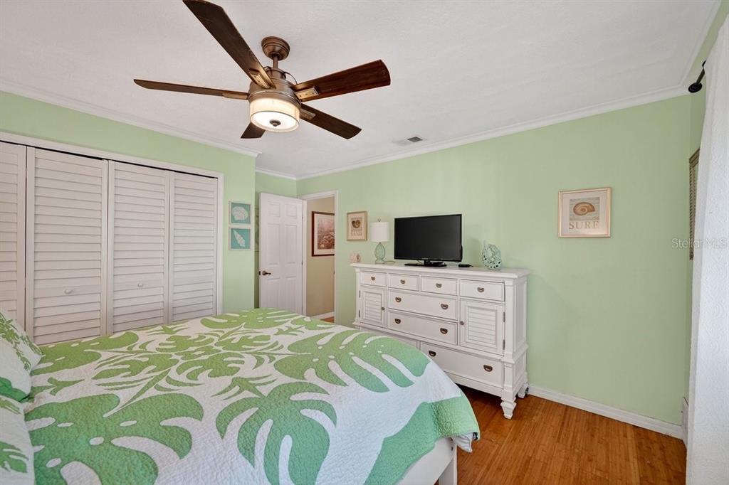 4758 South Peninsula Drive Ponce Inlet, FL 32127 - Photo 30 of 53 a bedroom with a bed and flat screen tv