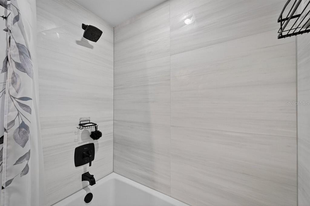 4758 South Peninsula Drive Ponce Inlet, FL 32127 - Photo 35 of 53 a bathroom with a shower