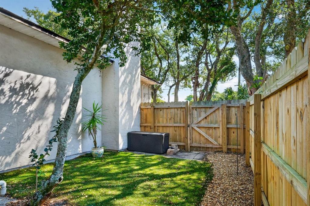 4758 South Peninsula Drive Ponce Inlet, FL 32127 - Photo 40 of 53 a view of an house with backyard and trees