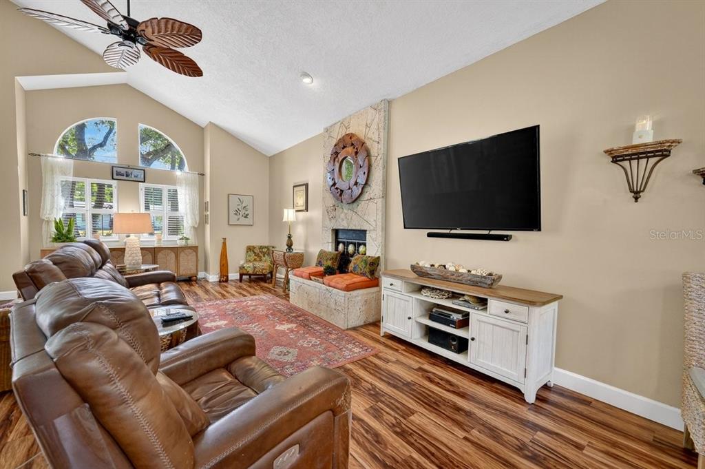 4758 South Peninsula Drive Ponce Inlet, FL 32127 - Photo 6 of 53 a living room with furniture and a flat screen tv