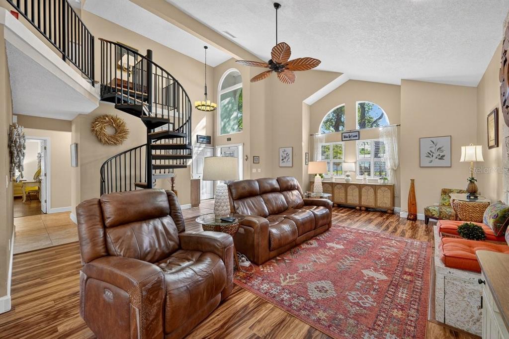 4758 South Peninsula Drive Ponce Inlet, FL 32127 - Photo 7 of 53 a living room with furniture ceiling fan and a window