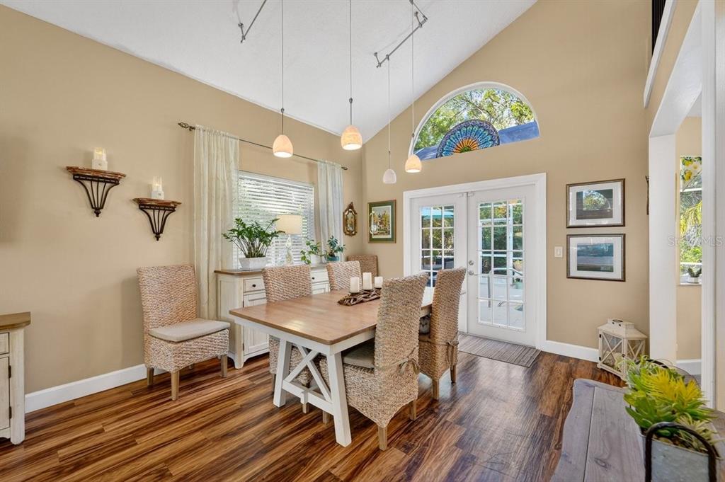4758 South Peninsula Drive Ponce Inlet, FL 32127 - Photo 9 of 53 a view of a dining room with furniture window and wooden floor