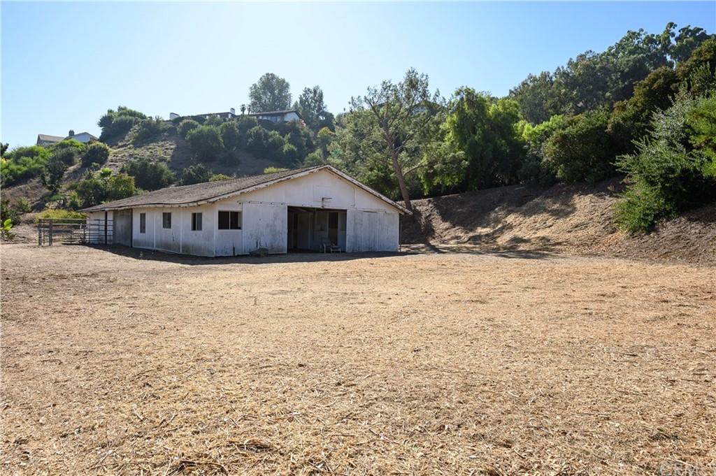 4 Poppy Trail Rolling Hills, CA 90274 - Photo 15 of 22 a view of a house with a yard