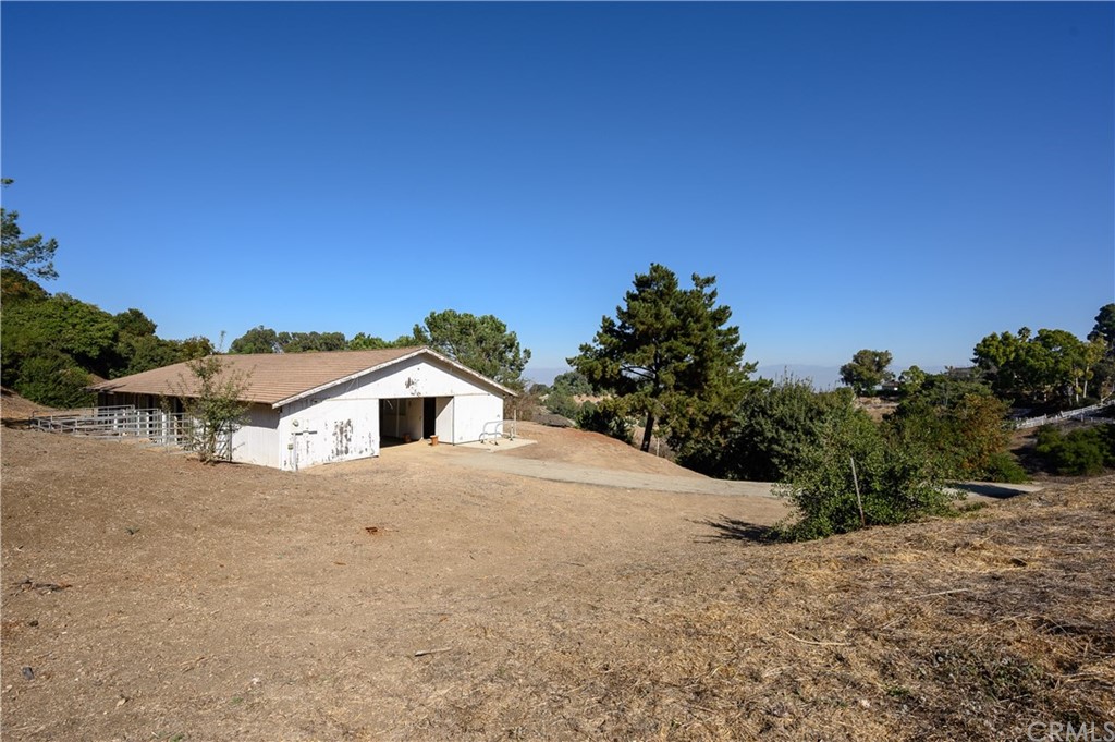 4 Poppy Trail Rolling Hills, CA 90274 - Photo 21 of 22 a view of a house with a yard