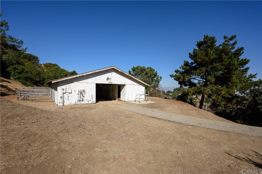 4 Poppy Trail Rolling Hills, CA 90274 - Photo 10 of 22 a yellow house with a yard
