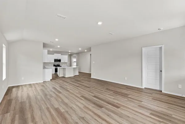 a view of kitchen with wooden floor