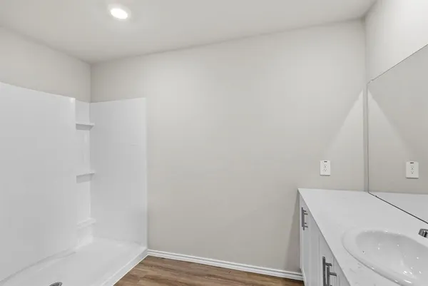 a bathroom with a sink and vanity
