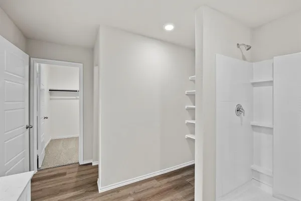 a view of a bathroom with wooden floor