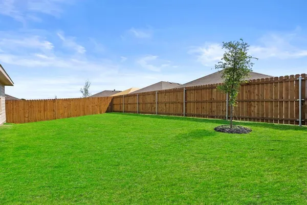 a backyard of a house with lots of green space
