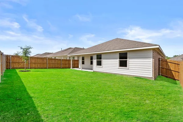 a backyard of a house with lots of green space