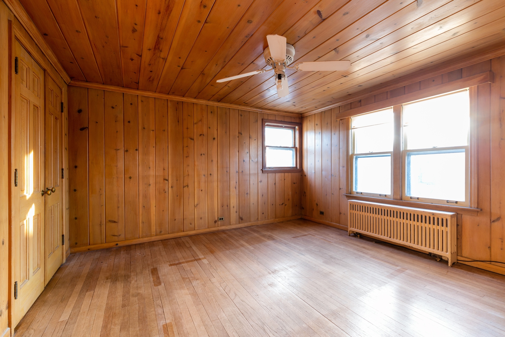 870 Half Day Road Highland Park, IL 60035 - Photo 5 of 10 an empty room with wooden floor and windows