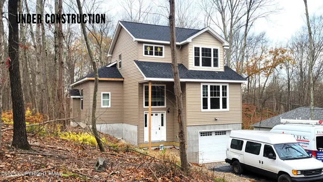a house view with a garden space