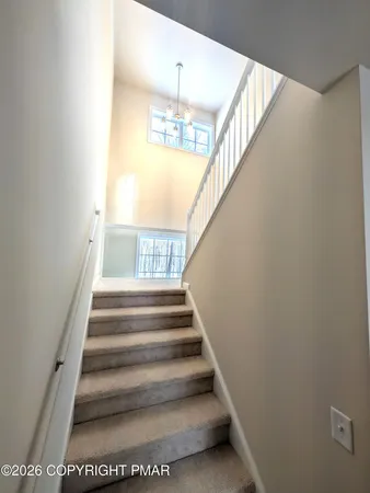 a view of an empty room and a window