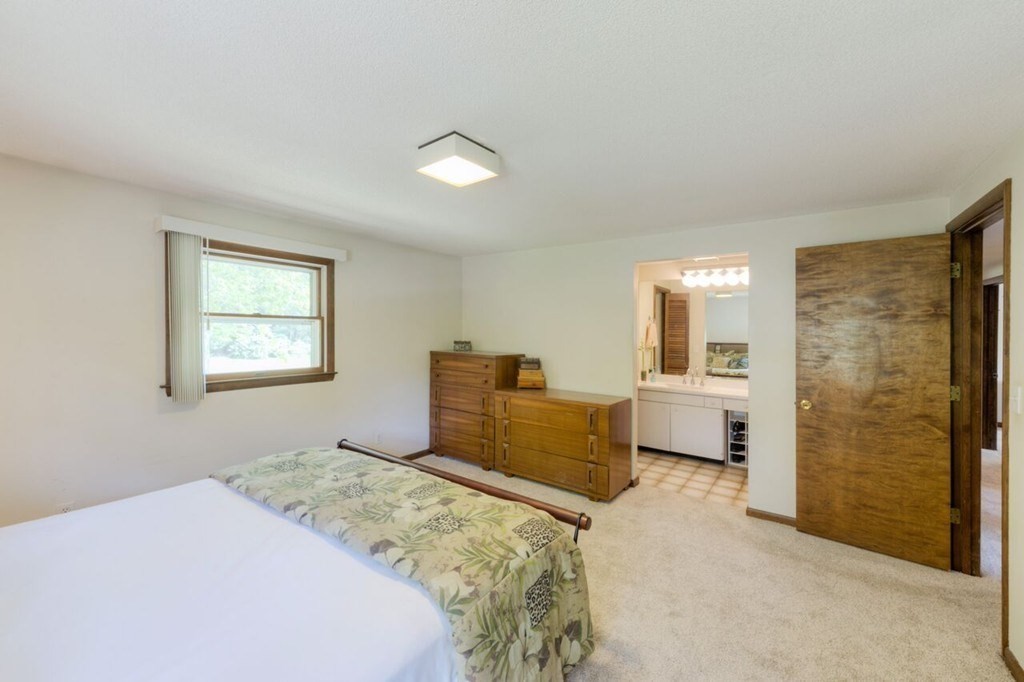 4 Hawthorne Road Wilbraham, MA 01095 - Photo 19 of 29 a bedroom with a bed and a view of bathroom