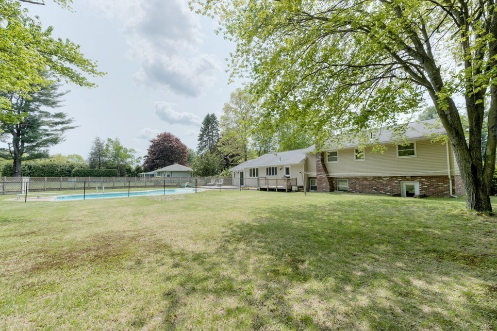 4 Hawthorne Road Wilbraham, MA 01095 - Photo 27 of 29 a backyard of a house with lots of green space