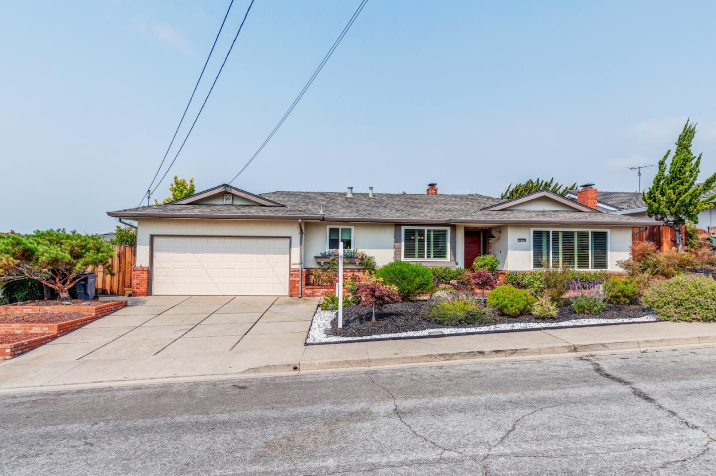 2479 Longview Drive San Leandro, CA 94577 - Photo 1 of 57 a front view of a house with a yard and potted plants
