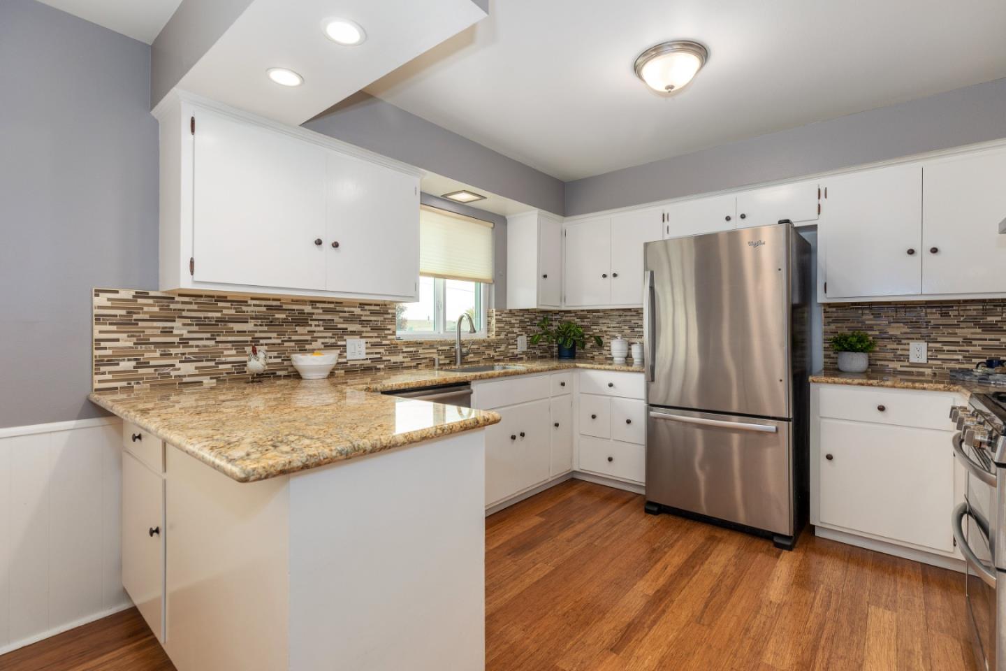 2479 Longview Drive San Leandro, CA 94577 - Photo 13 of 57 a kitchen with white cabinets sink and refrigerator