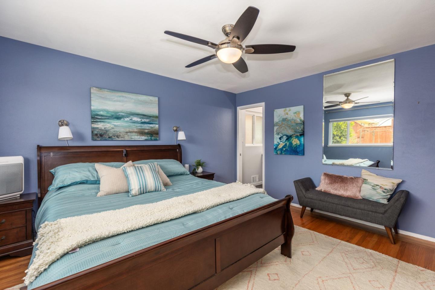 2479 Longview Drive San Leandro, CA 94577 - Photo 21 of 57 a bedroom with a bed and a chandelier