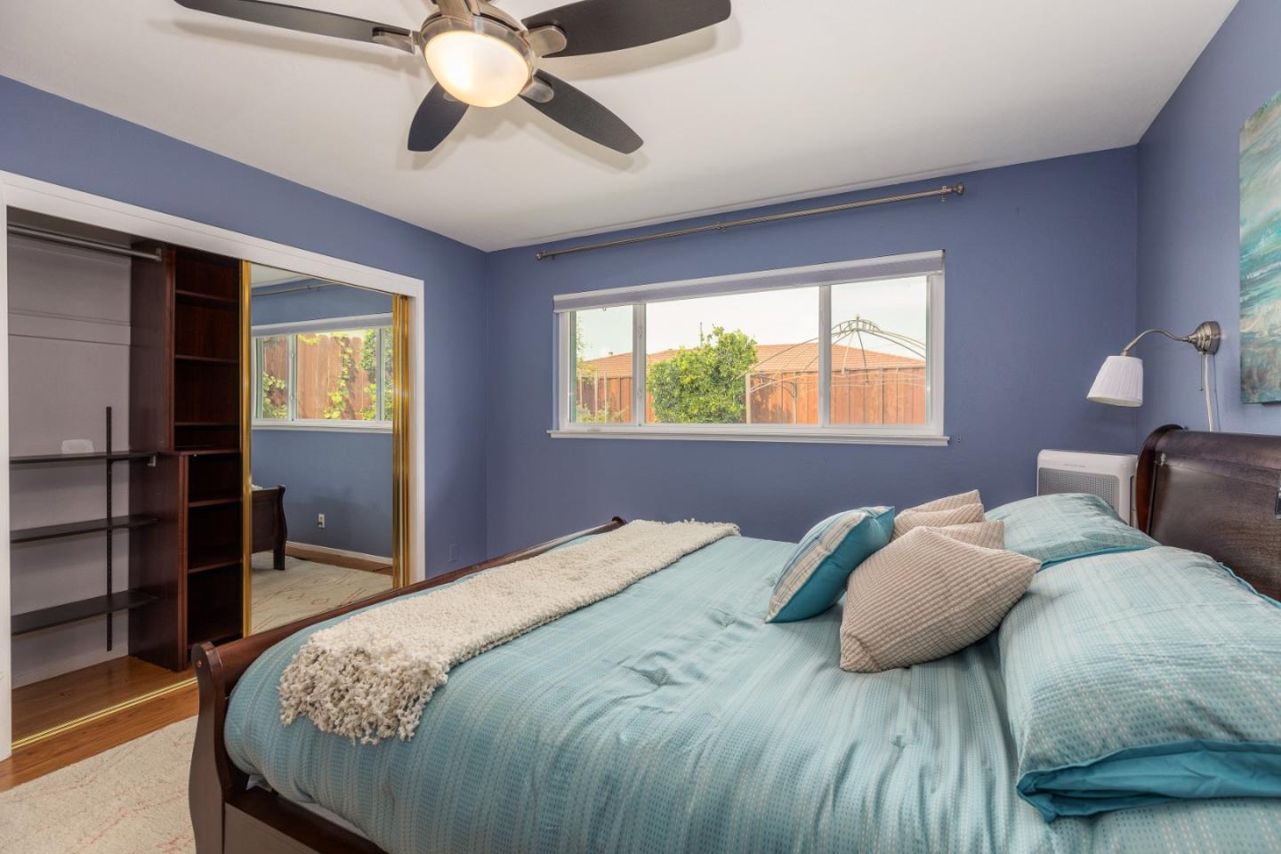 2479 Longview Drive San Leandro, CA 94577 - Photo 22 of 57 a bedroom with a bed and a chandelier