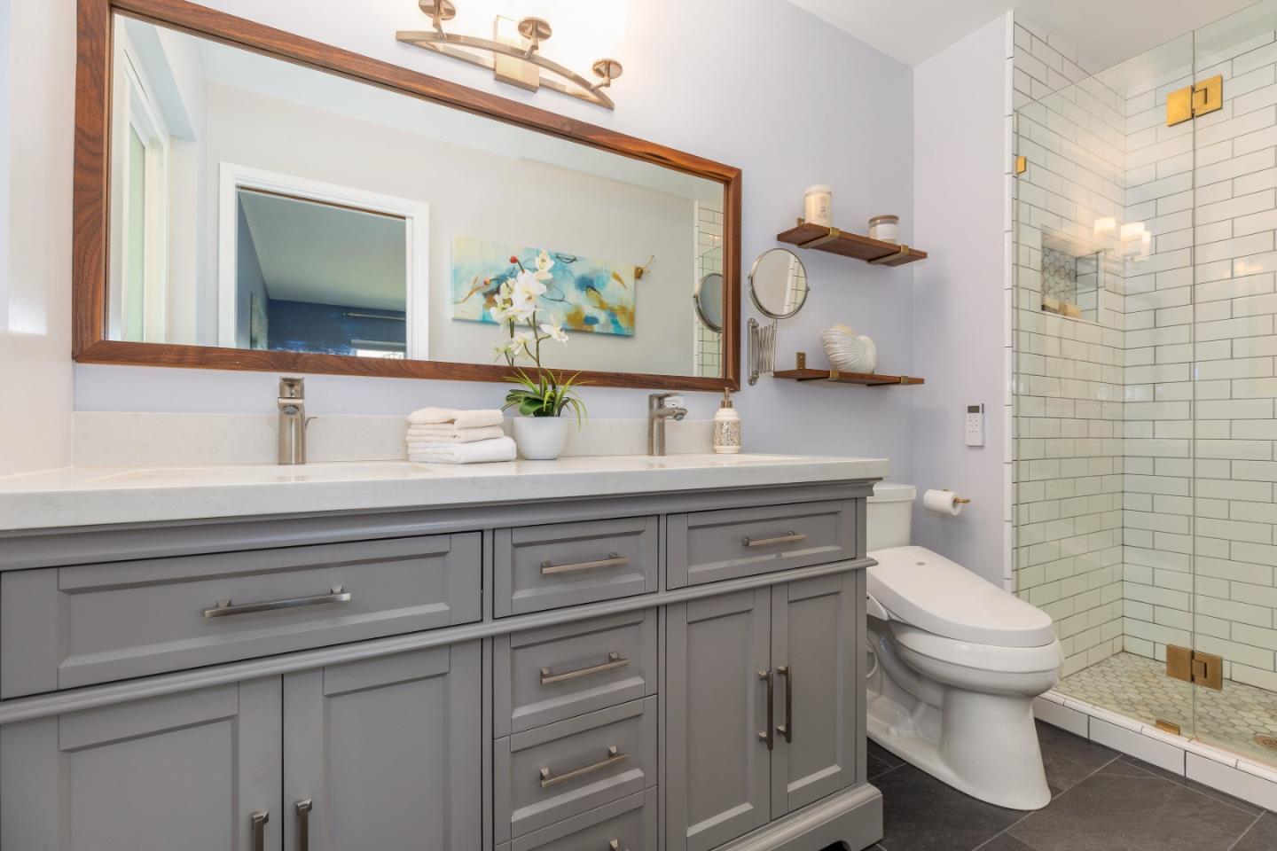 2479 Longview Drive San Leandro, CA 94577 - Photo 23 of 57 a bathroom with a toilet sink and mirror