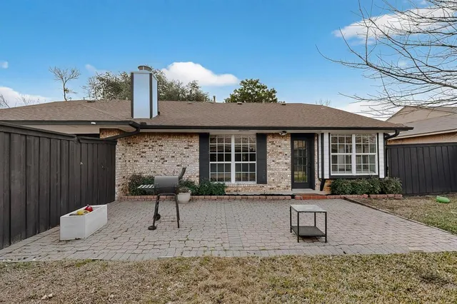 a swimming pool with outdoor seating