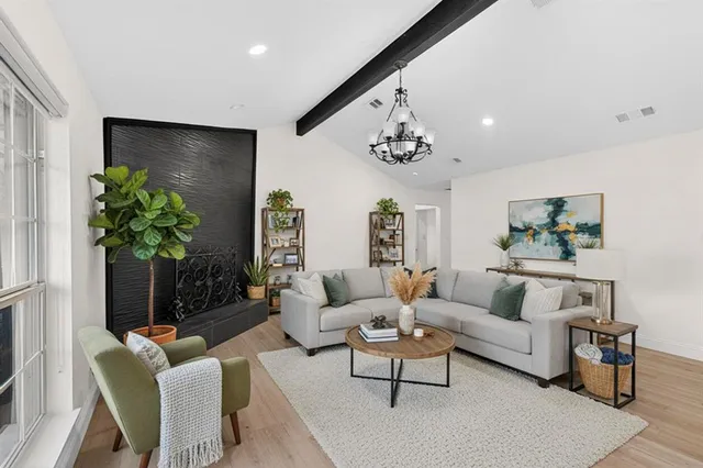 a kitchen with granite countertop stainless steel appliances and wooden cabinets