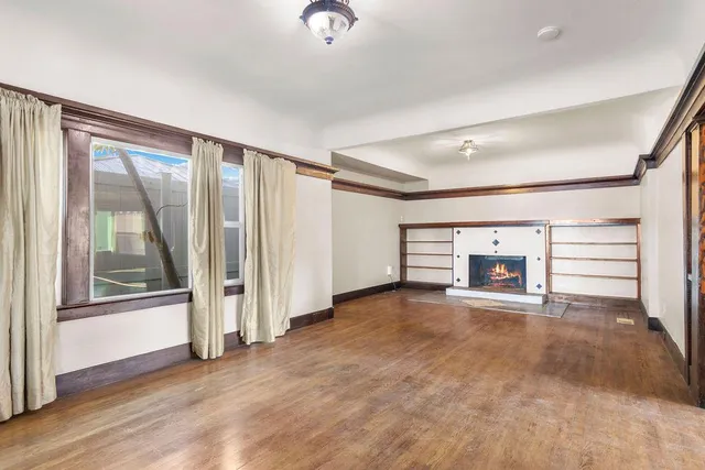 a view of an empty room and a window