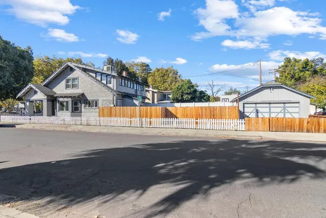 a view of house with yard