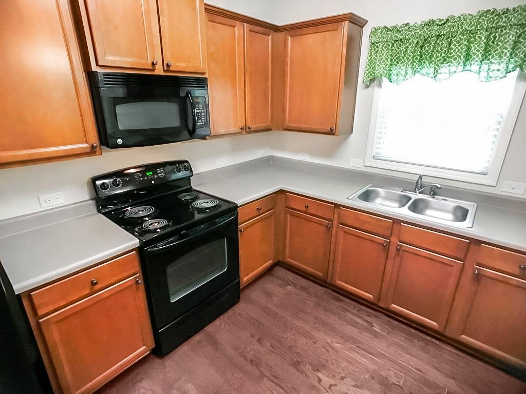 206 Madison Avenue Acworth, GA 30102 - Photo 13 of 39 a kitchen with stainless steel appliances a stove microwave and sink