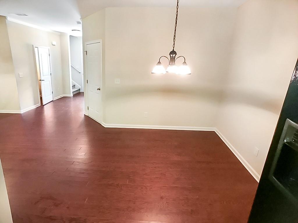 206 Madison Avenue Acworth, GA 30102 - Photo 15 of 39 a view of a room with wooden floor and white walls