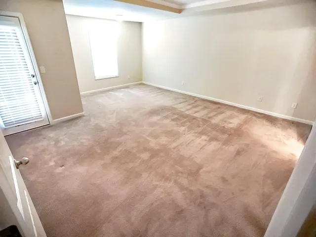 a view of a big room with closet and mirror