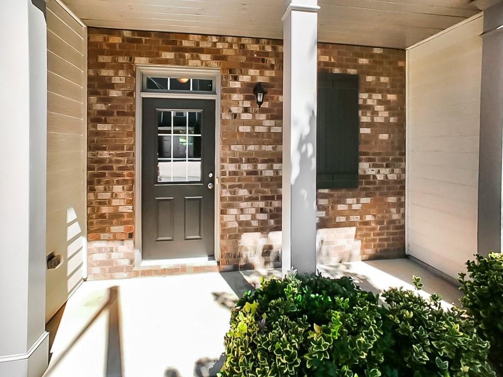 206 Madison Avenue Acworth, GA 30102 - Photo 2 of 39 a front view of a house with a glass door