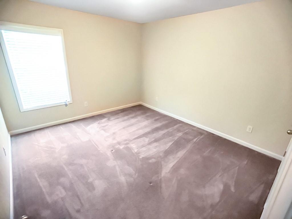 206 Madison Avenue Acworth, GA 30102 - Photo 29 of 39 an empty room with a window