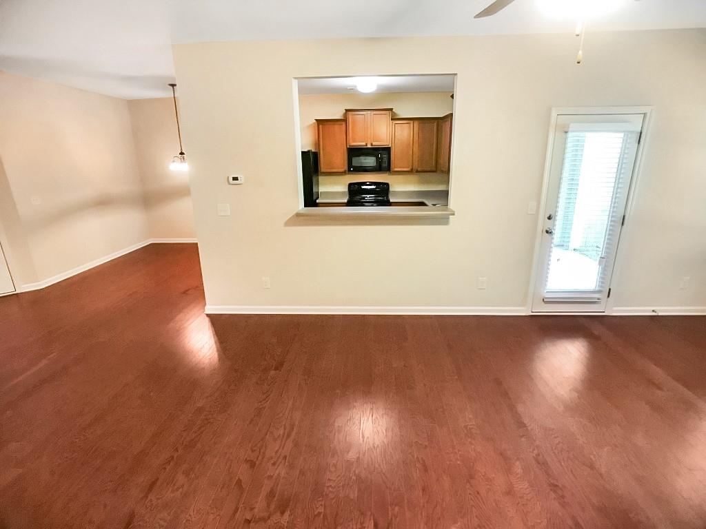 206 Madison Avenue Acworth, GA 30102 - Photo 9 of 39 a view of a living room and kitchen with wooden floor
