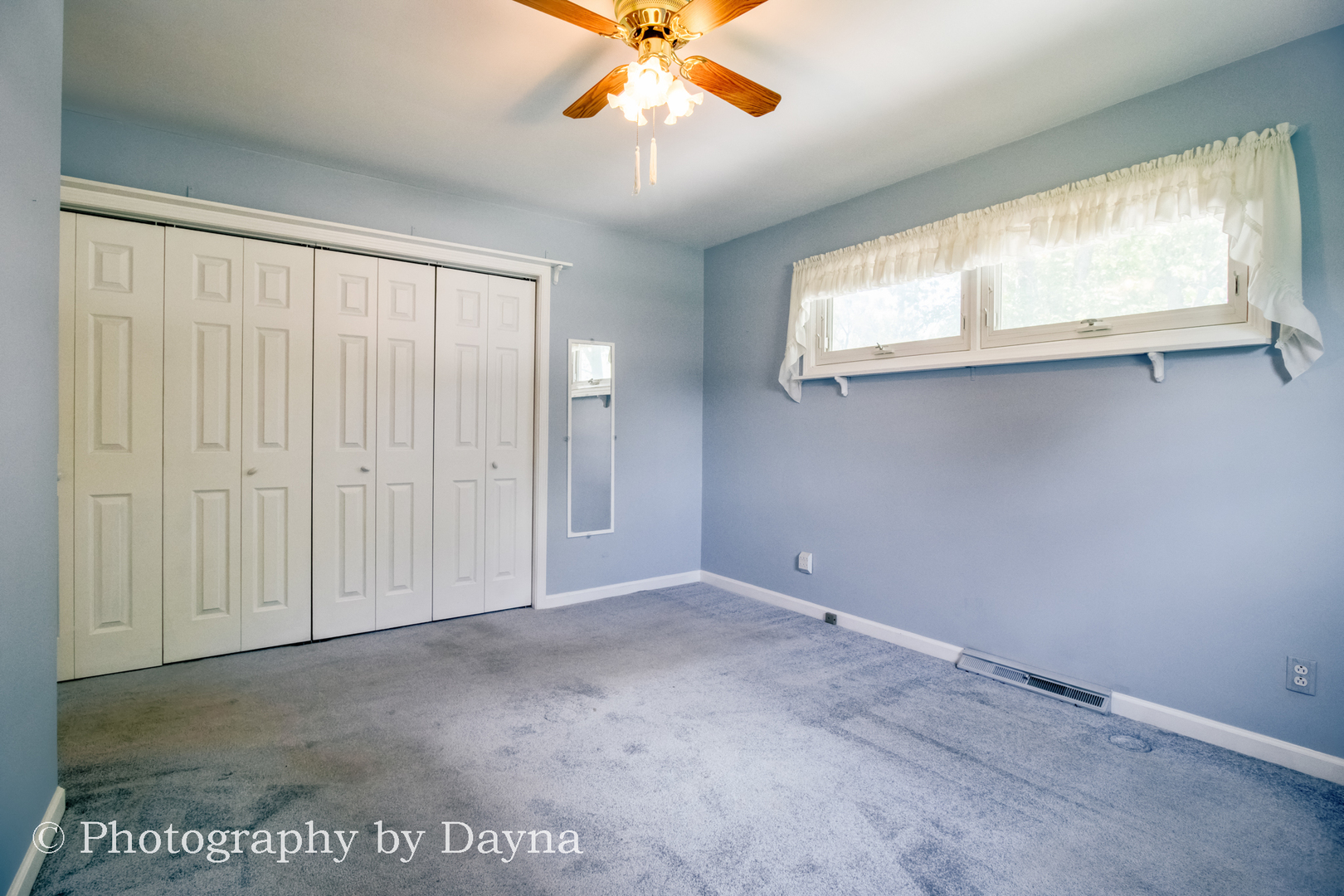 6 Park Place Kankakee, IL 60901 - Photo 15 of 36 an empty room with windows and fan