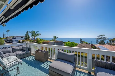 a view of a balcony with furniture