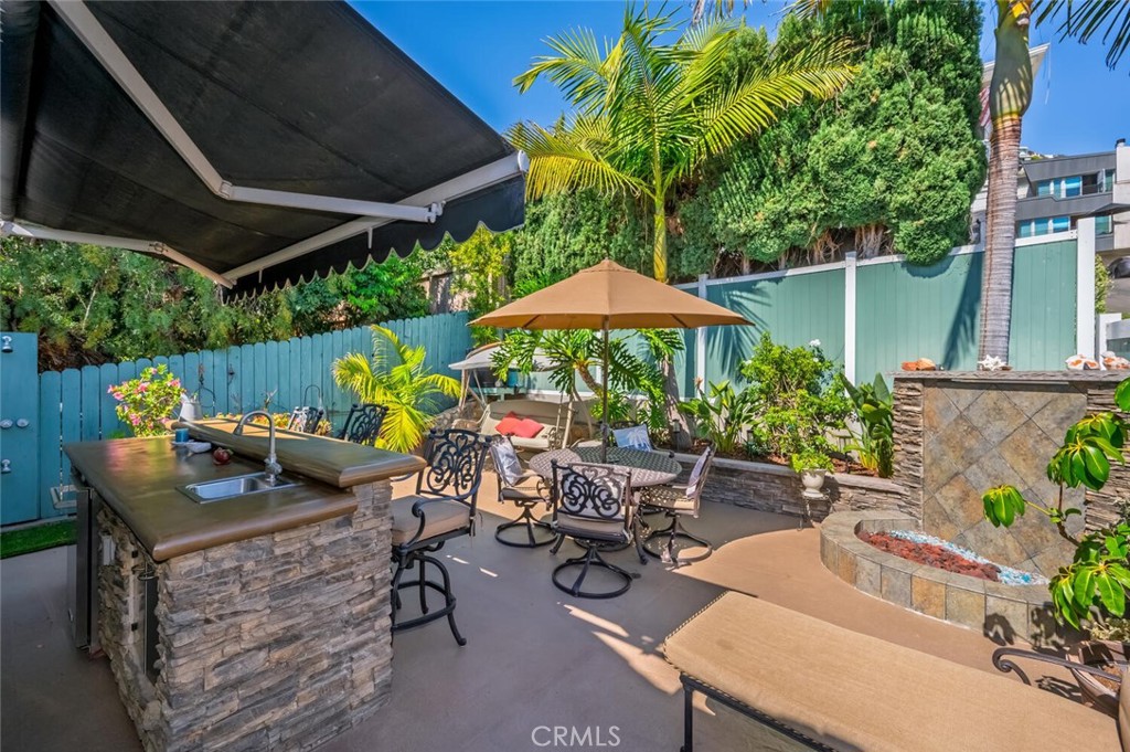 2896 Terry Road Laguna Beach, CA 92651 - Photo 54 of 74 Backyard with outdoor kitchen and fir pit.