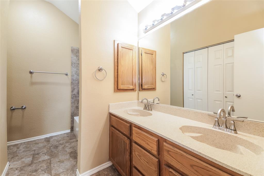 2313 Crestview Lane Rowlett, TX 75088 - Photo 11 of 16 a bathroom with a sink and a mirror