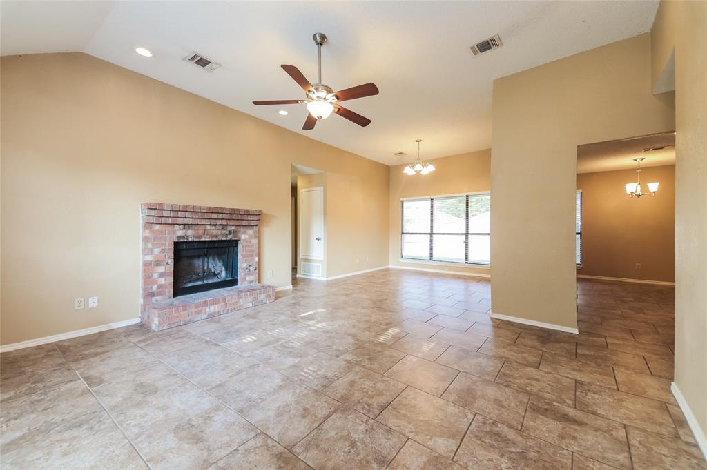 2313 Crestview Lane Rowlett, TX 75088 - Photo 3 of 16 a view of empty room with a fireplace and fan