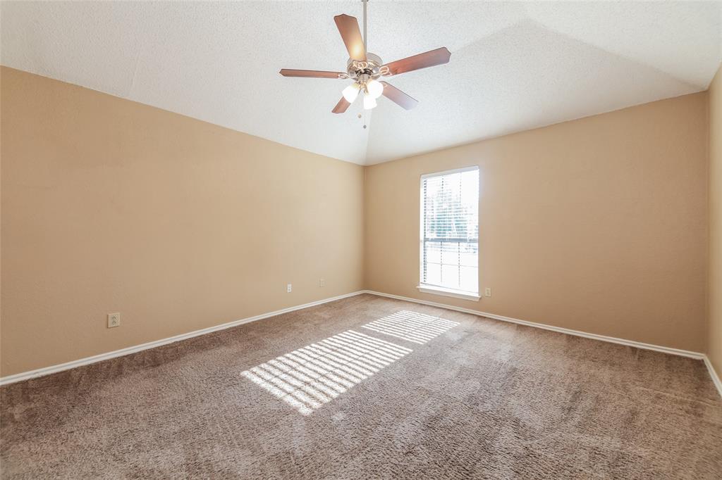 2313 Crestview Lane Rowlett, TX 75088 - Photo 9 of 16 an empty room with windows and fan