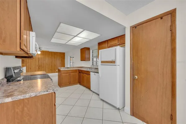 a view of a hallway to rooms